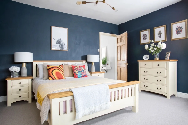 Eclectic Slatted Bed with Cream and Wood Furniture and Retro Pillows