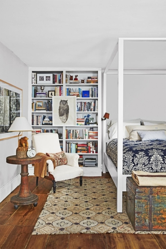 Eclectic Storage: White Canopy Bed and Floor-to-Ceiling Bookshelf