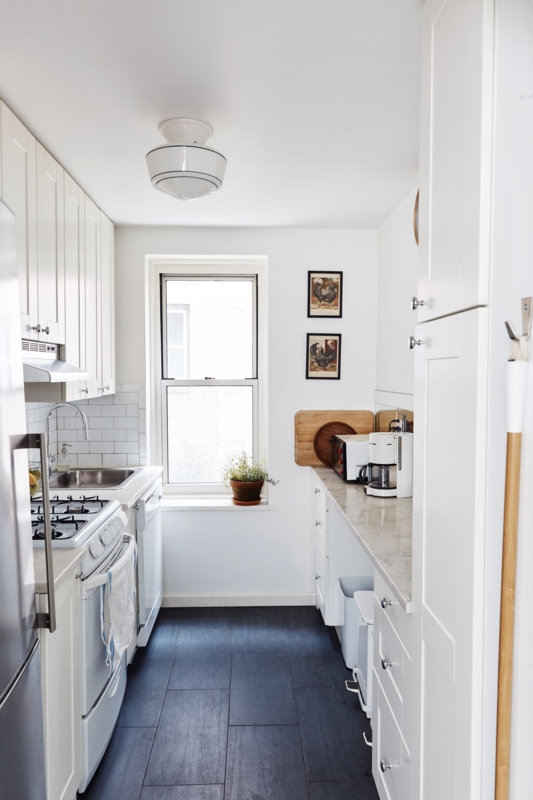 Efficient Narrow Galley Kitchen Layout with Charcoal Floors