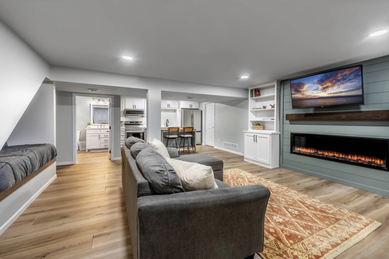 Electric Fireplace Shiplap Accent Wall in Blue-Green with Reading Nook