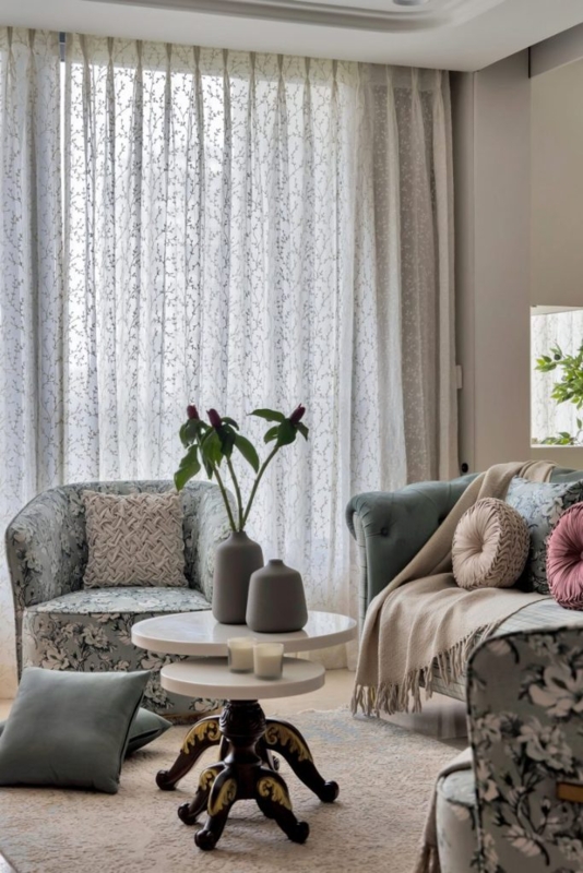 Elegant Botanical Sheer Curtains paired with Teal Tufted Sofa