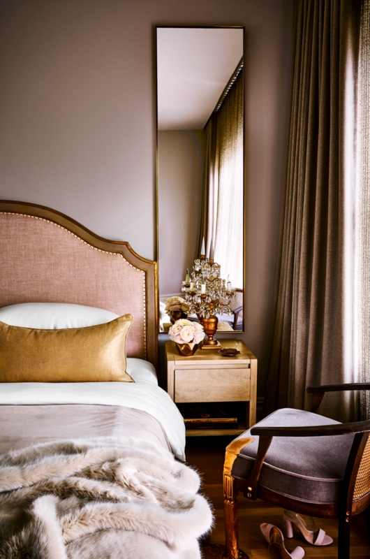 Elegant Upholstered Bed: Curved Headboard, Faux Fur Throw & Gold Pillow