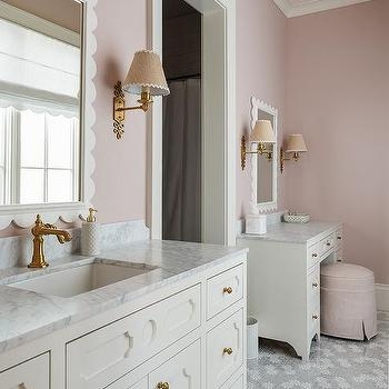 Elegant Vanity Area with scalloped mirrors and floral floor tiles.
