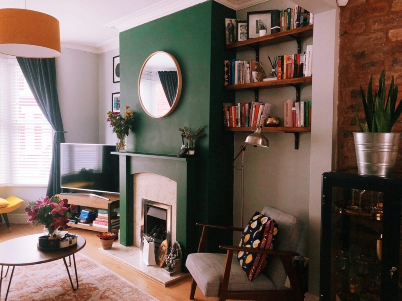Emerald Green Fireplace Accent Wall with Exposed Brick and Shelves