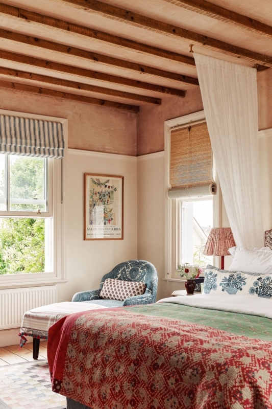 English Country Bedroom: Terracotta Wash Ceiling and Layered Textiles