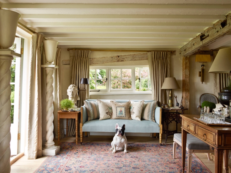 English Country Living Room with Pale Blue Sofa and Twisted Columns