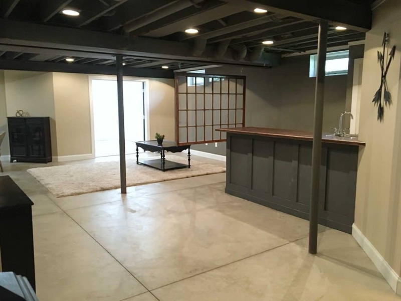 Entertainment Room with Shoji Style Room Divider and Concrete Floor