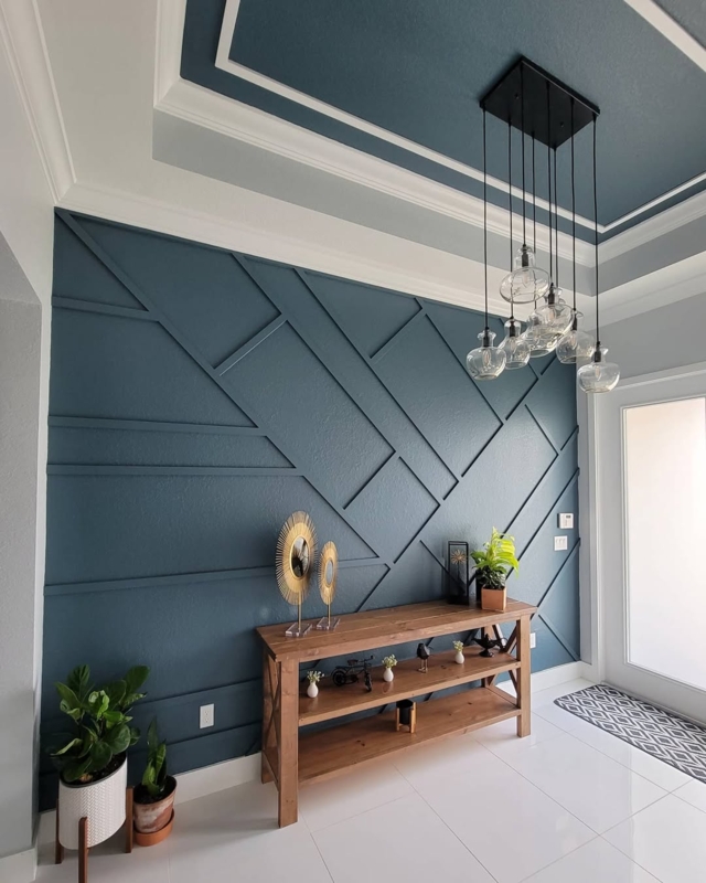 Entryway with Navy Geometric Accent Wall and Matching Tray Ceiling