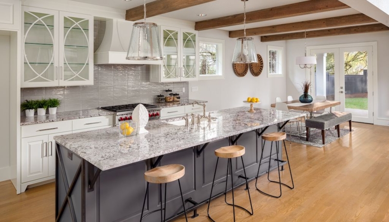 Exposed Wood Beams and Geometric Glass Front Cabinet Doors in Kitchen