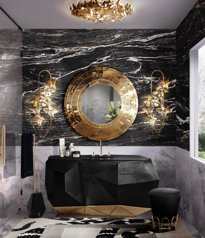 Faceted Vanity with Ornate Metallic Leaf Sconces against Marble Walls