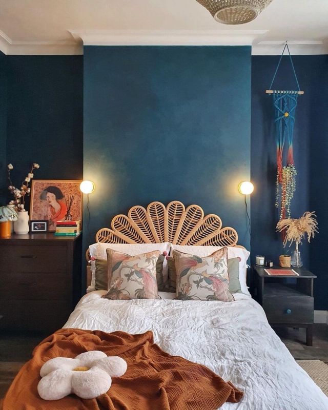 Fan-Shaped Rattan Headboard Against Dark Teal Wall