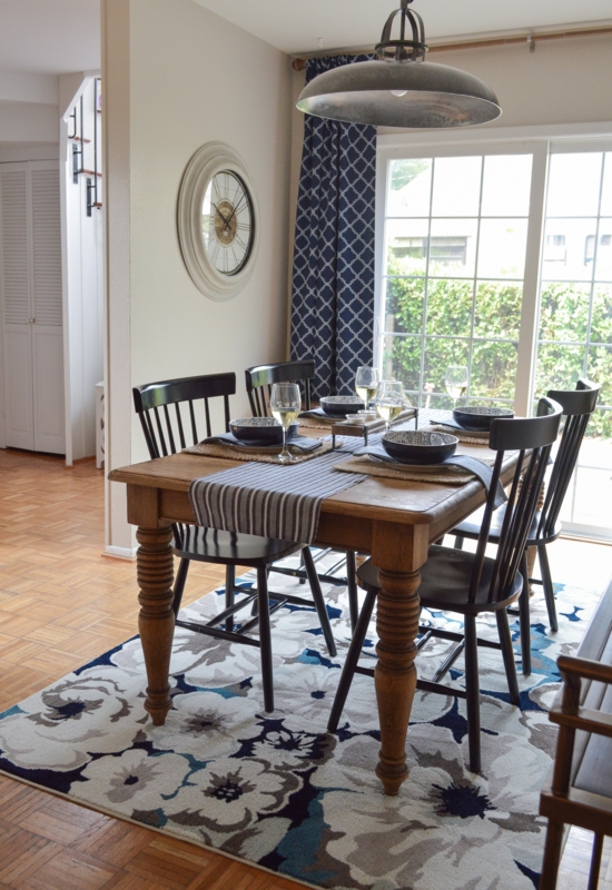 Farmhouse Dining Room: Navy Floral Pattern Rug & Black Spindle Chairs