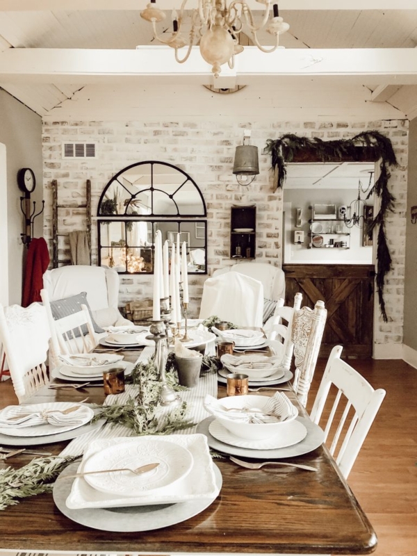 Farmhouse Dining Room: Whitewashed Brick Wall & Arched Black Mirror