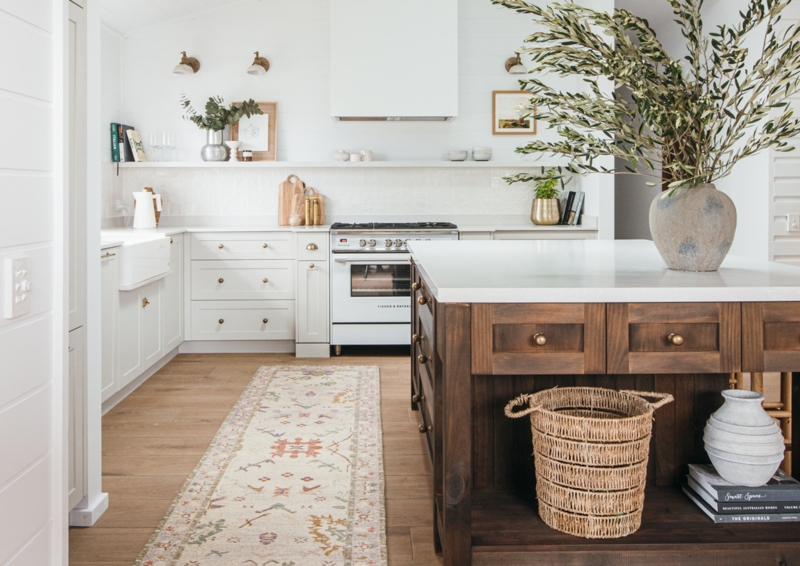 Farmhouse Kitchen: Patterned Runner Rug and Dark Wood Island with Brass