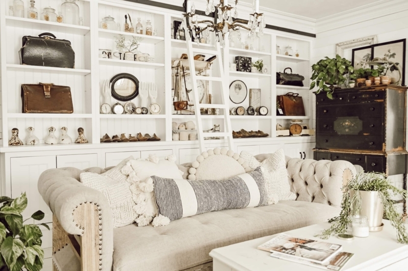 Farmhouse Living Room with Chesterfield Sofa & Wall-to-Wall Shelving