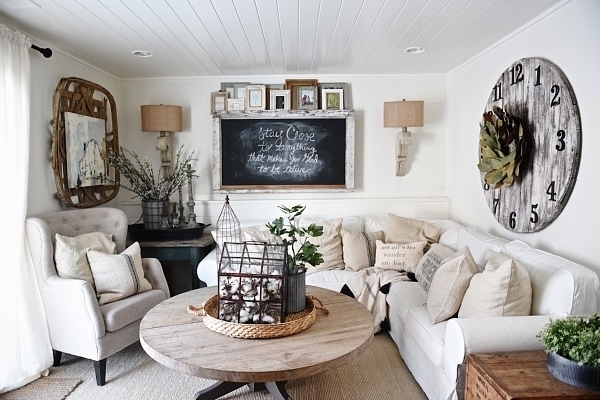 Farmhouse Living Room with Sectional, White Shiplap Ceiling & Wall Clock