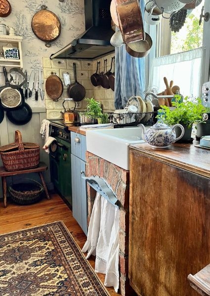 Farmhouse Sink With Brick Base And Toile Wallpaper Backdrop