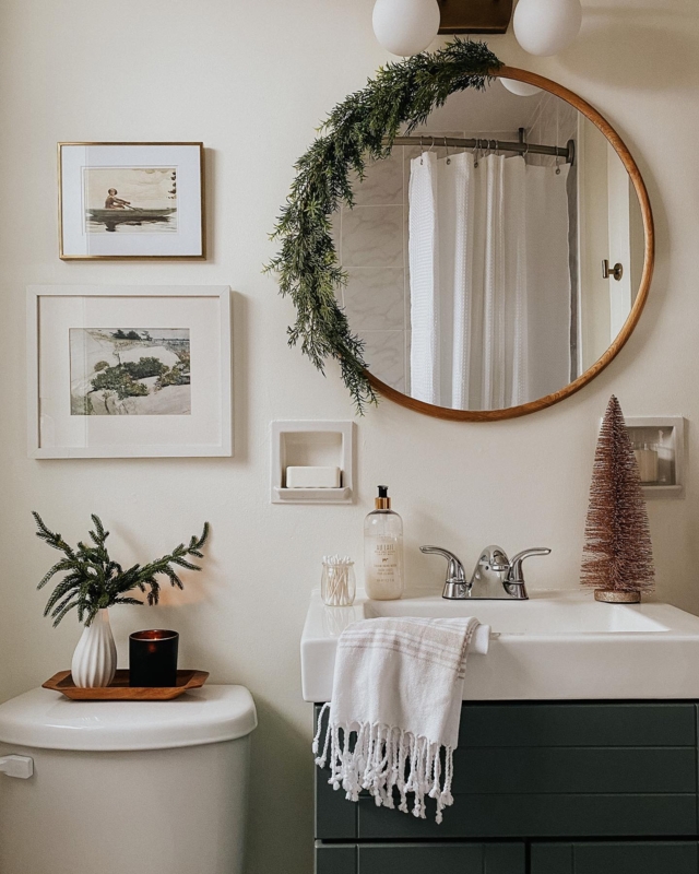 Festive Mirror Garland Styling over a Dark Green Bathroom Vanity