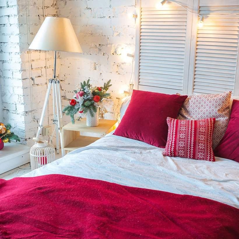Festive Red and White Bedroom with Textured White Brick Wall Decor