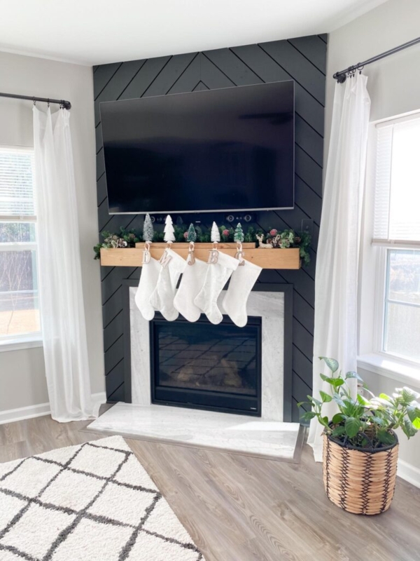 Fireplace with Black Chevron Accent Wall and Floating Wood Mantel