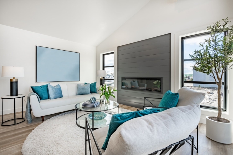 Fireplace with Grey Shiplap Wall and Teal Accent Pillows
