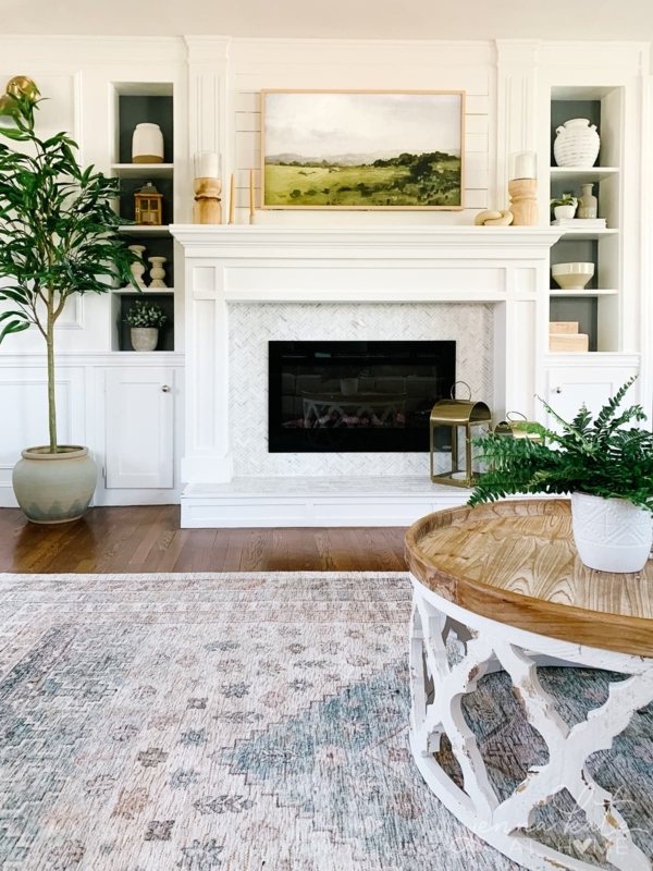 Fireplace with Herringbone Tile Surround and White Built-in Shelving