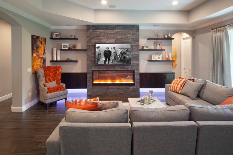 Fireplace with Stacked Stone Wall and Orange Textile Accents