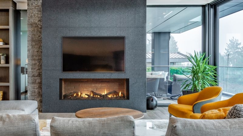 Fireplace with Stone Accent Wall and Yellow Accent Chairs