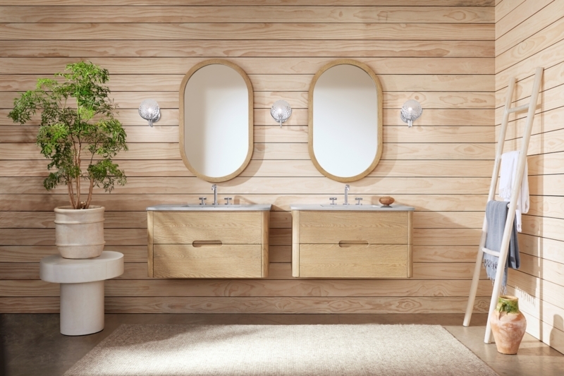 Floating Double Vanity with Horizontal Wood Paneling & Oval Mirrors in Bath