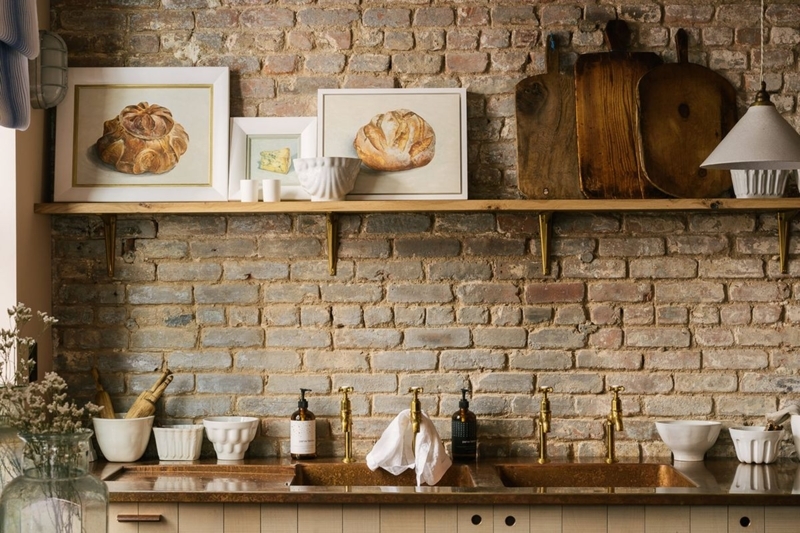Floating Shelf with Bread Art Gallery over Copper Countertop and Brick