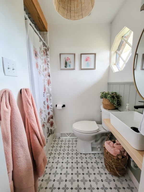 Floating Vanity with Vessel Sink, Sage Green Wainscoting, and Hexagon Window