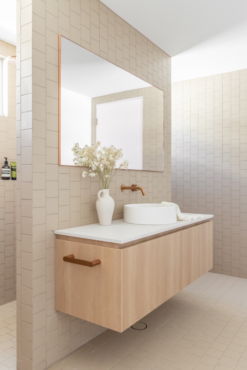 Floating Wood Vanity with Copper Faucet & Vertical Tile Stack in Serene Bath