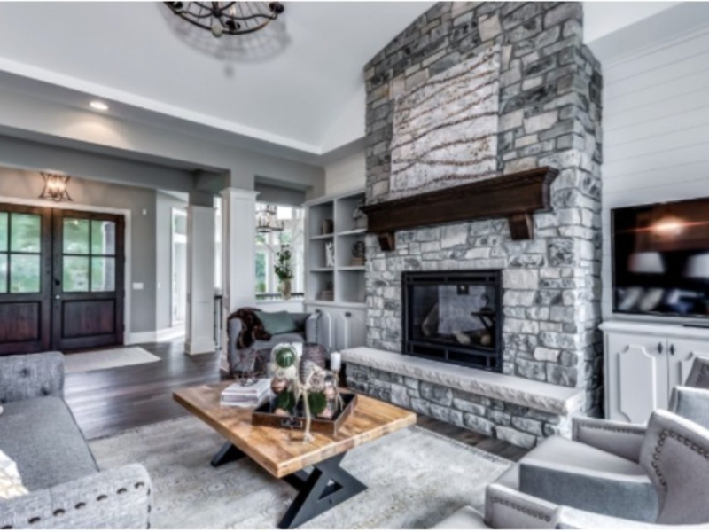 Floor-To-Ceiling Stone Fireplace In Transitional Great Room