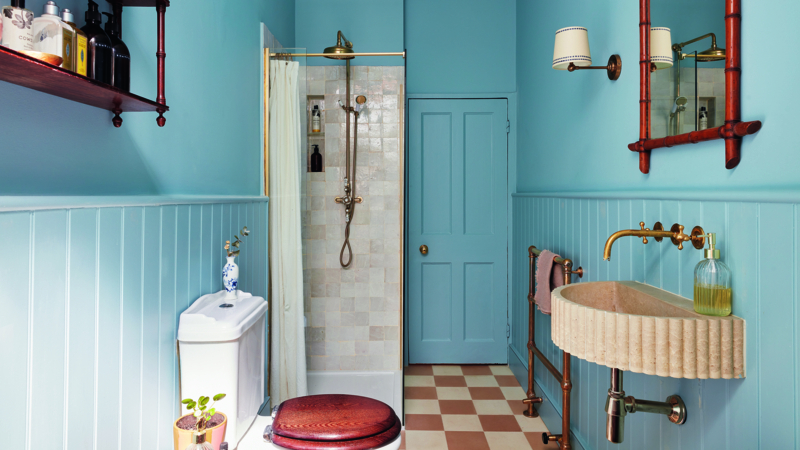 Fluted Stone Wall-Mounted Sink with Beadboard Wainscoting