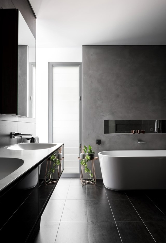 Freestanding Bathtub with Concrete Render Walls and Vertical Window