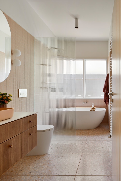 Freestanding Tub with Fluted Glass Partition & Terrazzo Floor Design
