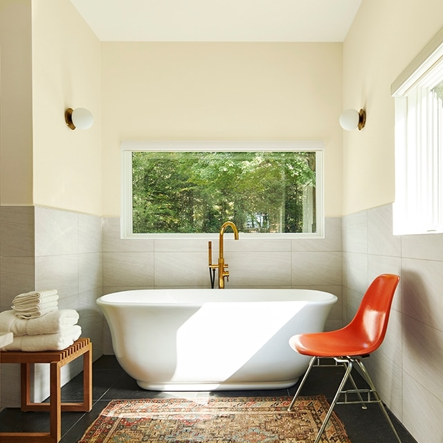 Freestanding Tub with Gold Faucet: Modern Bathroom Orange Accent Chair