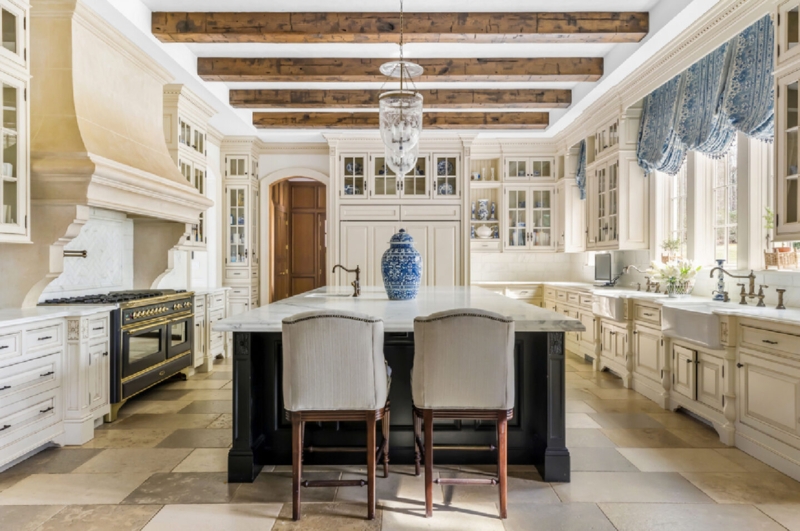 French Country Kitchen Design with Reclaimed Beams and Stone Hood