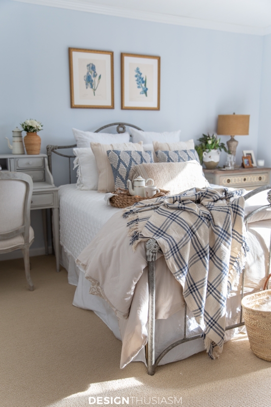 French Country Metal Bed with Plaid Throw and Botanical Wall Art