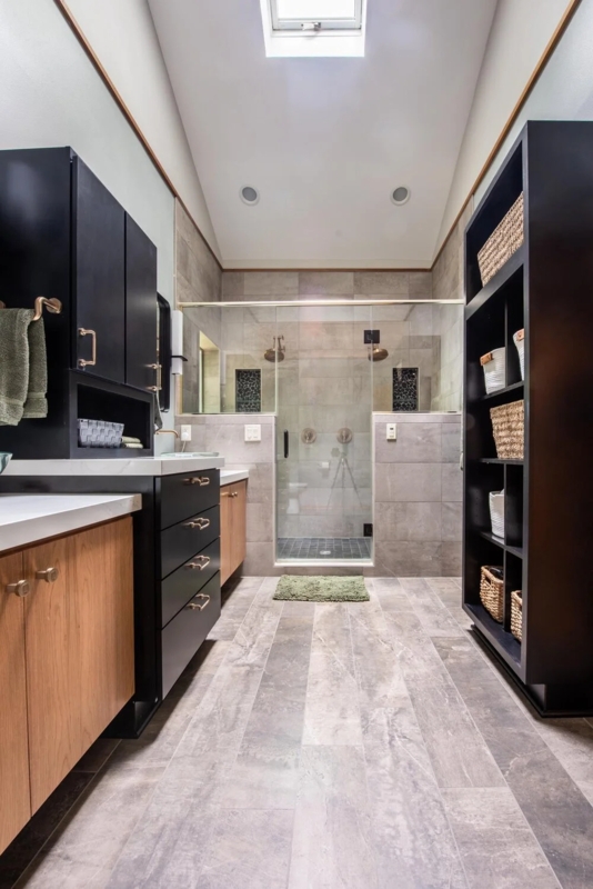 Galley Bathroom Design With Skylight And Mixed Finish Vanity Cabinets