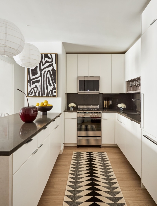 Galley Kitchen Design with Geometric Floor Runner and Graphic Art