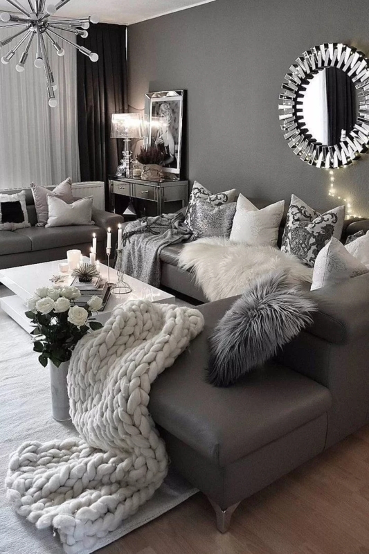 Glam Monochromatic Living Room Decor with Mirrored Console and Fur