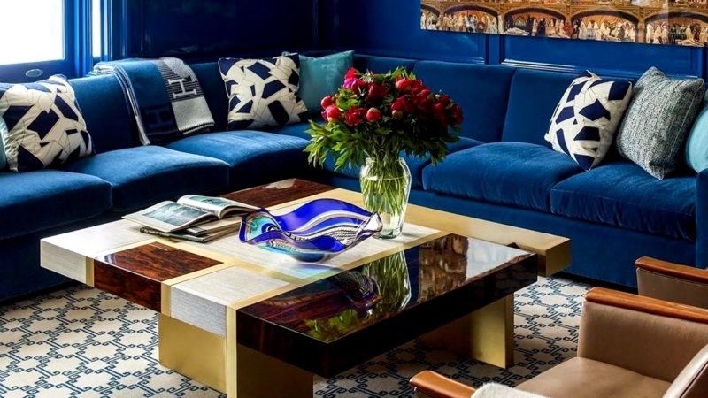 Glam Sectional with Geometric Block Coffee Table and Red Floral Pop