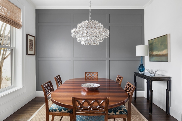 Gray Paneled Accent Wall Dining Room with Traditional Oval Wood Table