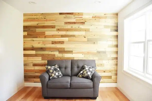 Gray Upholstered Loveseat with Horizontal Shiplap Wood Wall