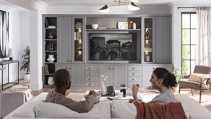 Grey Entertainment Center with Integrated Lighting and Shaker Doors