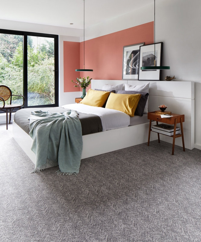 Grey Herringbone Carpet in Modern Bedroom with Terracotta Accent Wall