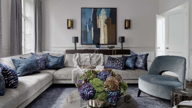 Grey Living Room with Blue Velvet Accent Chair and Large Abstract Art