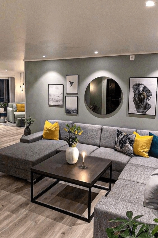 Grey Sectional Sofa with Mustard Yellow Accents and Gallery Wall Mirror