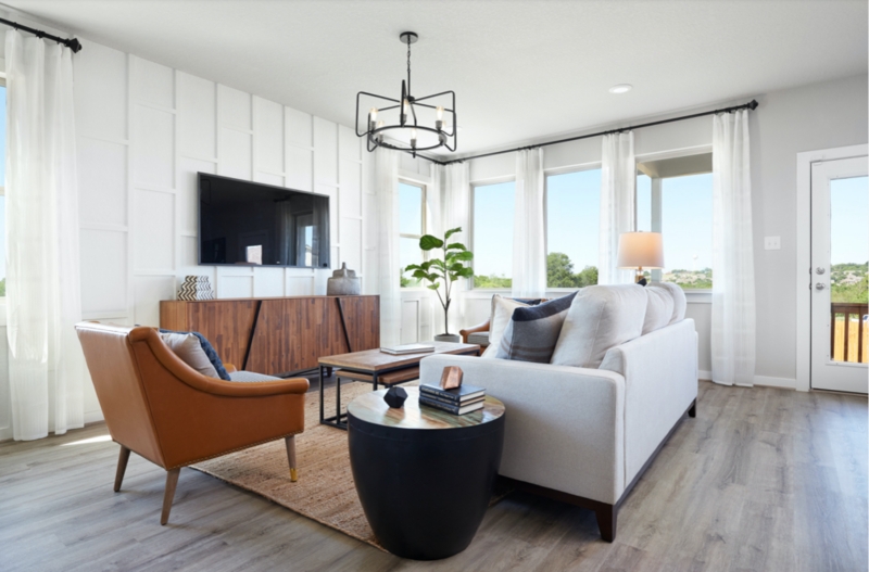 Grid Wall Paneling with Wood Credenza and Wagon Wheel Chandelier